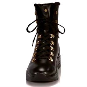 Stuart Weitzman Black with gold boots.